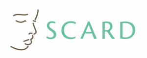 logo for SCARD the black outline of a side face with writing in green saying Scard